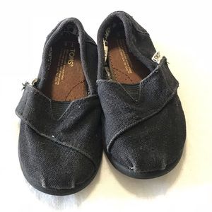Black Toms slide on toddler shoes